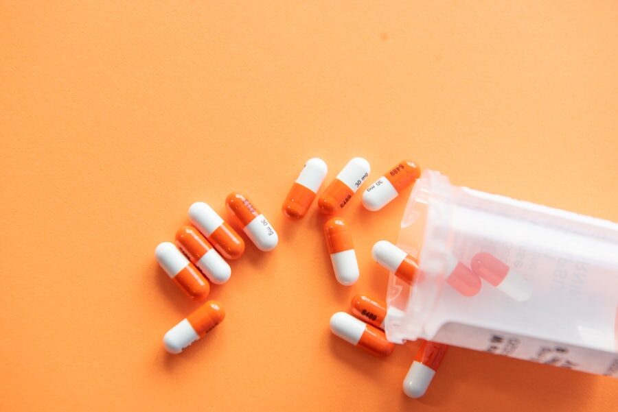 Pharmacist verifying a vial of medicine before dispensing